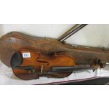 A violin & 2 bows in case, label reads 'Piena student violin,