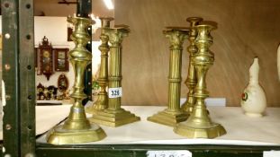 3 pairs of brass candlesticks