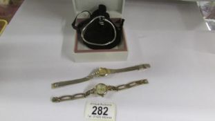 A Pandora bracelet with limited edition Pandora charm and 2 ladies wristwatches