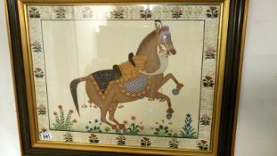 A framed & glazed fabric picture of a horse