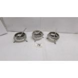 3 silver salts with silver spoons