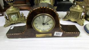 An inlaid mantel clock