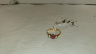 An 18ct gold ring with ruby and diamonds,