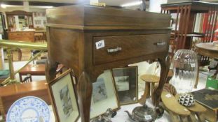 An oak cutlery table (no cutlery)