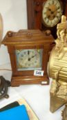 A oak cased striking mantel clock by John Piggott Ltd, Cheapside & milk St E.