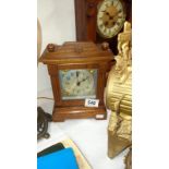 A oak cased striking mantel clock by John Piggott Ltd, Cheapside & milk St E.