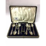 A cased set of silver teaspoons with sugar tongs,