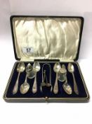 A cased set of silver teaspoons with sugar tongs,