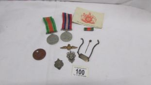 A defence medal, war medal, dog tag,