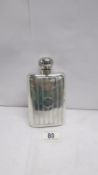 A solid silver hip flask