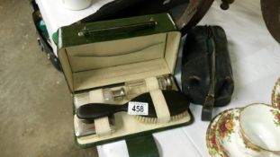 A super Edwardian toilet set in leather case & a small 1930's leather handbag