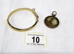 A rolled gold bracelet and a photo fob