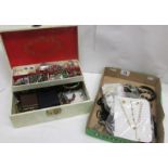 A white jewellery box of costume jewellery together with a tray of mostly black costume jewellery