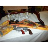 A quantity of childrens play guns, including boxed Lonestar western revolver