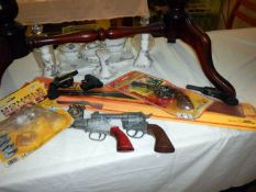 A quantity of childrens play guns, including boxed Lonestar western revolver