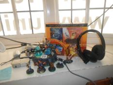 8 Skylanders figurines a Turtle beach headset, Lion king dvd etc