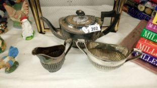 A silver plate teapot milk & sugar