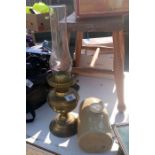An oil lamp & stone water bottle