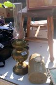 An oil lamp & stone water bottle