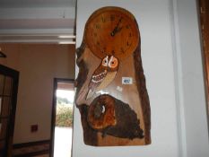 A wood clock, with bark & owl features