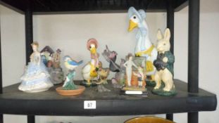 A quantity of figurines including birds etc.