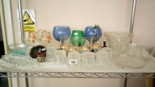 A shelf of glassware etc