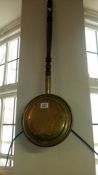 A brass warming pan