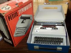 A boxed Petite typewriter & Olivetti Dora typewritter