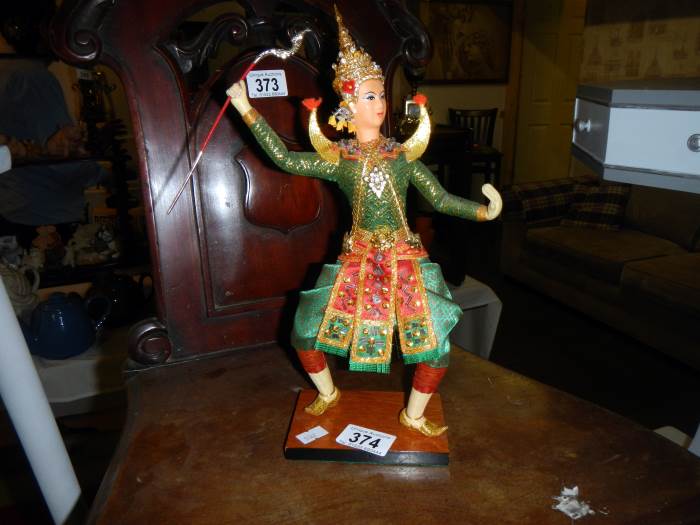 A figure of a Siamese dancer