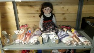 A Porcelin doll & 6 other dolls