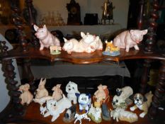 A quantity of animal figurines including pigs