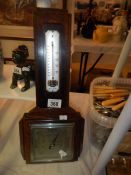 An oak cased barometer