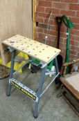 A workbench, garden strimmer etc