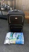 A large suitcase & a caravan top cover