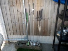 A quantity of golf clubs