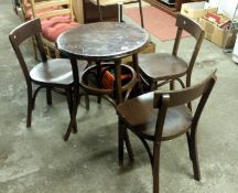 A round pub table and 3 chairs