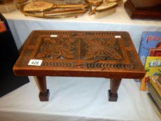 A carved wooden stool