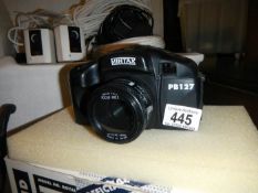 A boxed Mintax camera