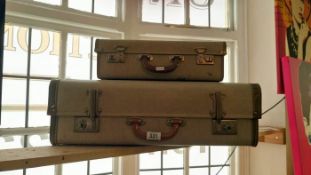 A vintage suitcase & matching smaller case