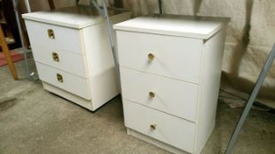 2 white bedside cabinets