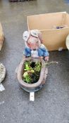 A squirrel garden planter