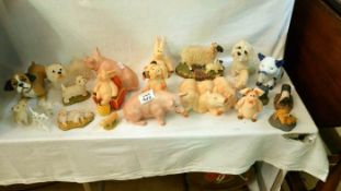 A quantity of pig & dog figurines