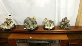 4 wolf figurines