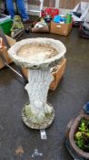 A stone bird bath