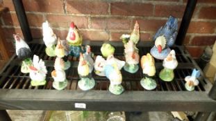 A quantity of rooster figurines