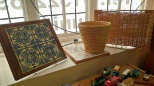 A framed tile display baskets etc