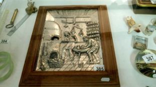 A framed metal affect picture of bakers