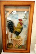 A framed 3D collage of a Rooster