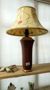 A pottery table lamp with shade