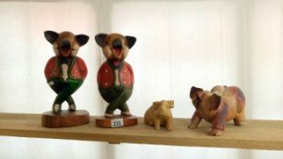 4 wooden pig figurines